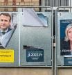 Electoral posters for France's President Emmanuel Macron, left, and presidential candidate Marine Le Pen on notice boards in Lens, France, on Saturday, April 2, 2022. Lens is a microcosm of industrial France, mirroring many parts of the country where Macron has struggled to loosen the grip of his nationalist nemesis Le Pen. Photographer: Anita Pouchard Serra/Bloomberg