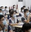 PUTIAN, CHINA - OCTOBER 11: Grade nine students wearing masks have class at Putian No.2 Middle School on October 11, 2021 in Putian, Fujian Province of China. Schools in Putian reopen in turns from October 11 to 18 after a suspension due to the COVID-19 breakout in middle September. (Photo by VCG/VCG via Getty Images)