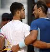 Tennis - ATP Masters 1000 - Madrid Open - Caja Magica, Madrid, Spain - May 6, 2022 Spain's Carlos Alcaraz Garfia with Spain's Rafael Nadal after their quarter final match REUTERS/Juan Medina