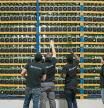 FILE: Employees check fans on mining machines at the Bitfarms cryptocurrency farming facility in Farnham, Quebec, Canada, on Wednesday, Jan. 24, 2018. The great cryptocurrency crash of 2018 is heading for its worst week yet. Bitcoin sank toward $4,000 and most of its peers tumbled on Friday, extending the Bloomberg Galaxy Crypto Index#{emoji}146;s weekly decline to 25 percent. That#{emoji}146;s the worst five-day stretch since crypto-mania peaked in early January. Photographer: Christinne Muschi/Bloomberg