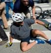 U.S. President Joe Biden falls to the ground after riding up to members of the public during a bike ride in Rehoboth Beach, Delaware, U.S., June 18, 2022. REUTERS/Elizabeth Frantz TPX IMAGES OF THE DAY