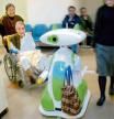 photograph by xavier cervera 02/2007 helping robot (bringing handbag and driving visitor or patient to the lift) at the ground floor of central hospital in aizu-wakamatsu, north japan