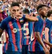 Barcelona's Raphinha celebrates with teammates after scoring during the international friendly football match between Barcelona and Real Madrid at Allegiant Stadium in Las Vegas, Nevada, on July 23, 2022. (Photo by Frederic J. BROWN / AFP)