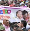 Supporters of the Colombian President-elect Gustavo Petro celebrate before his inauguration ceremony at the Bolivar square in Bogota, on August 7, 2022. (Photo by Raul ARBOLEDA / AFP)