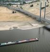 A cargo ship is sailing on the Rhine in Duesseldorf, Germany, Monday, Aug. 15, 2022. Due to the ongoing drought, the Rhine level has reached a low. The Rhine level near Cologne was 76 centimeters (low: 69 centimeters). In Düsseldorf, 34 centimeters were measured (23 centimeters). For the coming days, even further falling water levels are expected. (Federico Gambarini/dpa via AP)