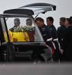 Pallbearers from the Queen's Colour Squadron (63 Squadron RAF Regiment) place the coffin of Queen Elizabeth II into the Royal Hearse at the Royal Air Force Northolt airbase on September 13, 2022, before it is taken to Buckingham Palace, to rest in the Bow Room. - Mourners in Edinburgh filed past the coffin of Queen Elizabeth II through the night, before the monarch's coffin returns to London to Lie in State ahead of her funeral on September 19. (Photo by Ben Stansall / POOL / AFP)