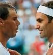 (FILES) In this file photo taken on July 12, 2019 Switzerland's Roger Federer (R) shakes hands and embraces Spain's Rafael Nadal (L) after Federer won their men's singles semi-final match on day 11 of the 2019 Wimbledon Championships at The All England Lawn Tennis Club in Wimbledon, southwest London. - Swiss tennis legend Roger Federer is to retire after next week's Laver Cup, he said on September 15, 2022. (Photo by Adrian DENNIS / POOL / AFP) / RESTRICTED TO EDITORIAL USE