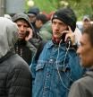 Russians, mostly men, lineup to get a Kazakh registration after crossing the border into Kazakhstan from the Mariinsky border crossing, about 400 km (250 miles) south of Chelyabinsk, in Russia, to Kazakhstan's town Uralsk, 1400 km east of Astana, the capital of Kazakhstan, Wednesday, Sept. 28, 2022. Russians have crossed into Kazakhstan in the week since President Vladimir Putin announced a partial mobilization of reservists to fight in Ukraine, Kazakh officials said Tuesday, as men seeking to avoid the call-up continued to flee by land and air into neighboring countries. (AP Photo/Denis Spiridonov)