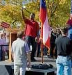 U.S. Senate candidate and former football player Herschel Walker takes a selfie while on stage at a campaign rally at the University of Georgia in Columbus, Georgia, U.S., October 21, 2022. REUTERS/Cheney Orr