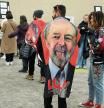 A man wears a cape with an image of Brazil's former President and presidential candidate Luiz Inacio Lula da Silva, as Brazilians in Canada vote during the second round of presidential elections, at a convention centre in Toronto, Ontario, Canada October 30, 2022. REUTERS/Chris Helgren
