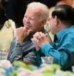 U.S. President Joe Biden, left, and Cambodian Prime Minister Hun Sen share a moment as they watch a cultural dance performance at the Association of Southeast Asian Nations (ASEAN) gala dinner, Saturday, Nov. 12, 2022, in Phnom Penh, Cambodia. (AP Photo/Alex Brandon)