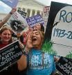 Anti-abortion campaigners celebrate outside the US Supreme Court in Washington, DC, on June 24, 2022. - The US Supreme Court on Friday ended the right to abortion in a seismic ruling that shreds half a century of constitutional protections on one of the most divisive and bitterly fought issues in American political life. The conservative-dominated court overturned the landmark 1973 