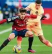 PAMPLONA, SPAIN - JANUARY 29: Abde Ezzalzouli of CA Osasuna is challenged by Nahuel Molina of Atletico Madrid during the LaLiga Santander match between CA Osasuna and Atletico de Madrid at El Sadar Stadium on January 29, 2023 in Pamplona, Spain. (Photo by Juan Manuel Serrano Arce/Getty Images)