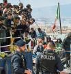FILE - Migrants disembark from a ship in the Sicilian port of Catania, Wednesday, April 12, 2023. European Union lawmakers approved on Thursday, April 20, 2023 a series of proposals aimed at ending the years-long standoff over how best to manage migration, a conundrum that has provoked one of the bloc's biggest political crises. (AP Photo/Salvatore Cavalli, File)
