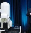 (FILES) This video grab made from the online Neuralink livestream shows Elon Musk standing next to the surgical robot during his Neuralink presentation on August 28, 2020. Elon Musk's start-up Neuralink on May 25, 2023 said it has gotten approval from US regulators to test its brain implants in people. Neuralink said clearance from the US Food and Drug Administration for its first in-human clinical study is 
