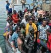 Migrants, whose boats sank in the sea and who were rescued by the Libyan Coast Guards at the Mediterranean Sea, arrive on a boat at the port, in Garaboli, Libya June 8, 2023. REUTERS/Ayman al-Sahili