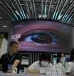 FOR USE WITH STORY CHINA AI TECH - A giant eye is displayed at booth during Security China 2023 in Beijing, on June 9, 2023. After years of breakneck growth, China's security and surveillance industry is now focused on shoring up its vulnerabilities to the United States and other outside actors, worried about risks posed by hackers, advances in artificial intelligence and pressure from rival governments. The renewed emphasis on self-reliance, combating fraud and hardening systems against hacking was on display at the recent Security China exhibition in Beijing. (AP Photo/Ng Han Guan)