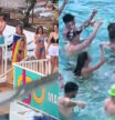 Una joven saca una estelada en una piscina y la gente de alrededor reacciona cantando “viva España”