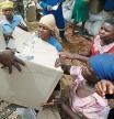 FILE PHOTO: Victims of Cyclone Idai receive food aid at Siverstream Estates in Chipinge, Zimbabwe March 24 ,2019. REUTERS/Philimon Bulawayo/File Photo