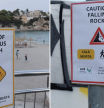 Los polémicos carteles de las playas de Mallorca para “espantar” a los guiris: “Peligro por medusas”