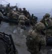 Ukrainian servicemen board a boat on the shore of Dnipro river at the frontline near Kherson, Ukraine, Sunday Oct. 15, 2023. (AP Photo/Mstyslav Chernov)
