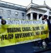 People hold a banner during a vigil denouncing violence of riots, following the stabbing of school children, in Dublin, Ireland November 27, 2023. REUTERS/Clodagh Kilcoyne