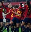 Spain's forward #22 Athenea del Castillo celebrates scoring the opening goal, with teammates, during the UEFA Women's Nations League group A4 football match between Spain and Italy at the Pasaron Municipal Stadium in Pontevedra. (Photo by MIGUEL RIOPA / AFP)