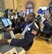 File - Traders work on the New York Stock Exchange floor in New York City on Friday, November 3, 2023. Wall Street followed global stocks lower on Monday as investors awaited a slew of economic data — mostly from the labor market — later in the week. (AP Photo/Ted Shaffrey, File)
