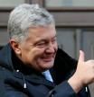 FILE PHOTO: Ukrainian former President Petro Poroshenko gives a thumbs-up as he greets supporters after a court hearing in Kyiv, Ukraine January 19, 2022. REUTERS/Gleb Garanich/File Photo