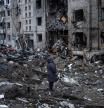 A woman looks at her apartment building heavily damaged by a Russian missile strike, amid Russia's attack on Ukraine, in Kyiv, Ukraine January 2, 2024. REUTERS/Viacheslav Ratynskyi