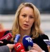 (FILES) This file photo taken on April 29, 2017 shows French far right party Front national members of Parliament Marion Marechal-Le Pen speaking to the press after attending a joint statement by French presidential election candidate for the far-right Front National (FN) party and Former French presidential election candidate for the right-wing Debout la France (DLF) at the FN headquarters in Paris. Marion Marechal-Le Pen will announce that she leaves her political mandates, according to the far-right National Front (Front National - FN) party, on May 9, 2017. / AFP PHOTO / GEOFFROY VAN DER HASSELT