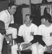 FILE - New York Yankees have a coffee break in the dressing room in Fort Lauderdale, Fla., in February 1977, before going out to work out the first day of baseball spring training. From left are coach Yogi Berra, Jim