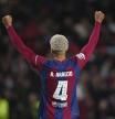 Barcelona's Ronald Araujo celebrates at the end of the Champions League, round of 16, second leg soccer match between Barcelona and SSC Napoli at the Olympic Lluis Companys stadium in Barcelona, Spain, Tuesday, March 12, 2024. Barcelona won 3-1. (AP Photo/Emilio Morenatti)