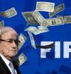 (FILES) This file photo taken on July 20, 2015 shows FIFA president Sepp Blatter looking on with fake dollars note flying around him thrown by a protester during a press conference at the football's world body headquarter's on July 20, 2015 in Zurich. Sepp Blatter earned 3.6 million Swiss francs ($3.7 million) in 2015, FIFA said on March 17, 2016 as it revealed the fallen world football leader's salary for the first time. / AFP PHOTO / FABRICE COFFRINI