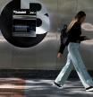 A woman walks past a branch of Spain's Sabadell bank in the Gran Via of Bilbao, Spain, May 9, 2024. REUTERS/Vincent West