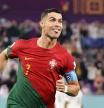 DOHA, QATAR - NOVEMBER 24: Cristiano Ronaldo of Portugal celebrates after scoring their team's first goal via a penalty during the FIFA World Cup Qatar 2022 Group H match between Portugal and Ghana at Stadium 974 on November 24, 2022 in Doha, Qatar. (Photo by Clive Brunskill/Getty Images)