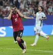 Georgia's Georges Mikautadze celebrates after scoring on a penalty kick during a Group F match between Georgia and Portugal at the Euro 2024 soccer tournament in Gelsenkirchen, Germany, Wednesday, June 26, 2024. (AP Photo/Martin Meissner)