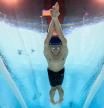 An underwater view shows France's Leon Marchand competing in the final of the men's 200m butterfly swimming event during the Paris 2024 Olympic Games at the Paris La Defense Arena in Nanterre, west of Paris, on July 31, 2024. (Photo by François-Xavier MARIT / AFP)