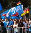 Erfurt (Germany), 31/08/2024.- Supporters of far-right Alternative for Germany party (AfD) await the speech of faction chairman in the regional parliament of Thuringia Bjoern Hoecke and top candidate for the upcoming 2024 Thuringia state election speaks during the final election campaign rally in Erfurt, Germany, 31 August 2024. The sign (R) reads lit. 'No more lies'. Thuringia state election, voting for the regional parliament 'Landtag', will be held on 01 September 2024. (Elecciones, Alemania) EFE/EPA/CLEMENS BILAN