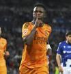 Real Madrid's Vinicius Junior celebrates after scoring the opening goal with a penalty kick during a Spanish La Liga soccer match between Real Sociedad and Real Madrid at the Reale Arena in San Sebastian, Spain