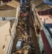 Volunteers and residents cleanup four days after flash floods swept away everything in their path in the town of Paiporta, the epicentre of the storm, outskirts of Valencia, Spain, Saturday, Nov. 2, 2024.(AP Photo/Angel Garcia)