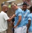 Pep Guardiola y Erling Haaland.