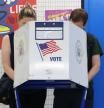 People vote at a polling location at Louis D. Brandeis High School on mayoral primary election day in the Manhattan borough of New York City on June 24, 2025. New York Democrats cast ballots Tuesday under smothering summer heat to choose the likely next leader of the largest US city, someone voters say must resist President Donald Trump and provide relief to high costs of living. With about a dozen candidates offering a range of personalities and proposals, the race is an increasingly tight contest between former governor Andrew Cuomo, 67, and state assemblyman Zohran Mamdani, 33, who has mounted a surprise challenge to the better-known but tainted frontrunner. (Photo by TIMOTHY A. CLARY / AFP)