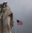 A US flag flies near the Peace Monument on the grounds of the US Capitol on the eighth day of the federal government shutdown on October 8, 2025, in Washington, DC. President Donald Trump said on October 6 that he would be