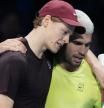 Italy's Jannik Sinner, left, and Spain's Carlos Alcaraz hug after the final tennis match of the ATP World Tour Finals, in Turin, Italy, Sunday, Nov. 16, 2025. (AP Photo/Antonio Calanni)