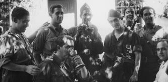 Captain Coche, government Chief of Transport, drinks communion wine from a chalice taken from a church in Buitrago during the Spanish Civil War, 8th September 1936. Buitrago was a small town near the dams, reservoirs, and aqueducts in the Sierra Norte range which were essential for supplying Madrid with water and for which there was a lot of fighting. (Photo by Fox Photos/Hulton Archive/Getty Images)