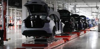 FILE - Cars on the manufacturing floor at the 
