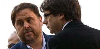 Catalan regional government president Carles Puigdemont (R) and Catalan vice president and chief of economy and finance Oriol Junqueras visit the grave of former Catalan leader Lluis Companys during a ceremony commemorating the 77th anniversary of his death at the Montjuic Cemetery in Barcelona on October 15, 2017. Companys had proclaimed a 