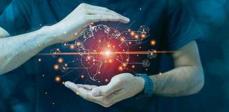 Artificial intelligence brain limitless connections, virtual globe on male hand with black background.