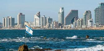 Israel, Tel Aviv . The Israel flag and, on the background, the town